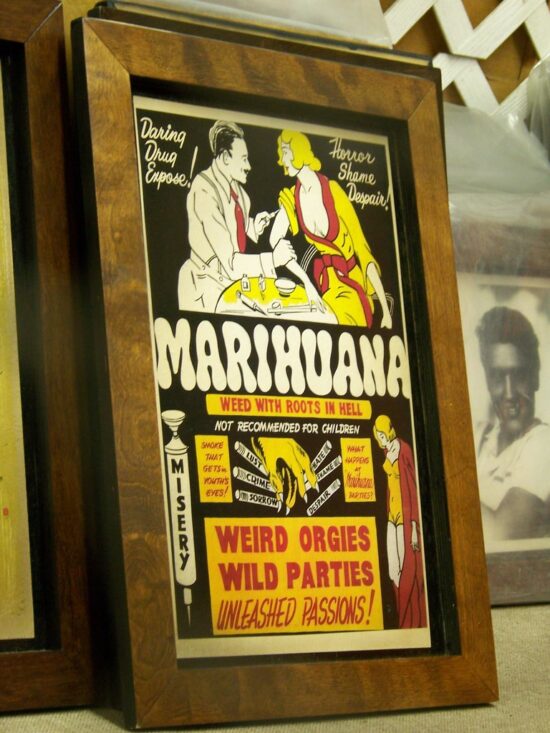 "Trip to Phoenix 2008" by Rusty Clark. Photos is licensed with cc by 2.0. (Photo of 1936 “Marihuana” movie poster.)