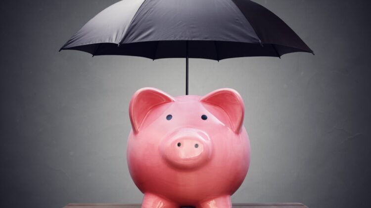 Piggy bank with umbrella concept for finance insurance, protection, safe investment or banking