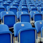 Empty blue chairs in a sports stadium