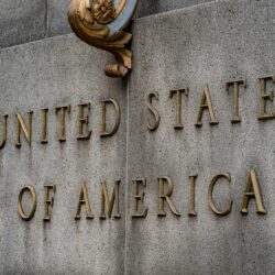 stained sign that reads United States of America