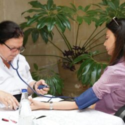 a medical provider takes a patient's blood pressure